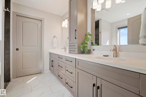 Dual vanity with light gray cabinetry, white countertops, and undermount sinks - 49279 Rge Rd 240, Rural Leduc County, AB 