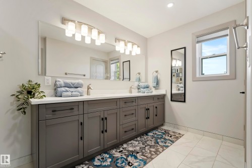 Dual vanity with a white countertop and rectangular undermount sinks - 49279 Rge Rd 240, Rural Leduc County, AB 