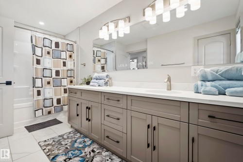 Double vanity with gray cabinetry and black hardware - 49279 Rge Rd 240, Rural Leduc County, AB 