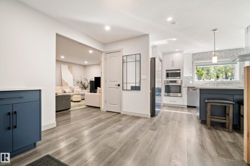 Wood-finish flooring throughout the main level - 49279 Rge Rd 240, Rural Leduc County, AB 