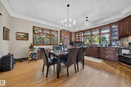 Wood-finish flooring with crown molding - 719 65 Ave Nw, Edmonton, AB 
