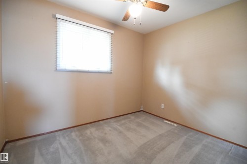 Both the second and third main floor bedrooms are nicely sized, with good closets, and the same upgraded vinyl windows found throughout the main floor - 10243 42 Street Nw, Edmonton, AB 