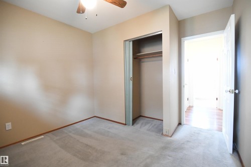 Both the second and third main floor bedrooms are nicely sized, with good closets, and the same upgraded vinyl windows found throughout the main floor - 10243 42 Street Nw, Edmonton, AB 