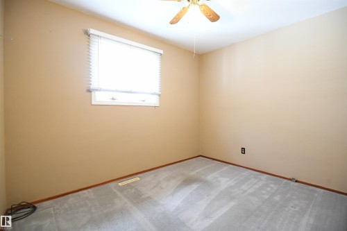 Both the second and third main floor bedrooms are nicely sized, with good closets, and the same upgraded vinyl windows found throughout the main floor - 10243 42 Street Nw, Edmonton, AB 