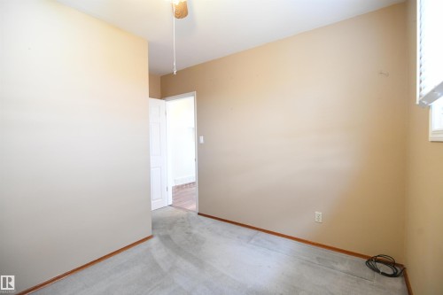 Both the second and third main floor bedrooms are nicely sized, with good closets, and the same upgraded vinyl windows found throughout the main floor - 10243 42 Street Nw, Edmonton, AB 