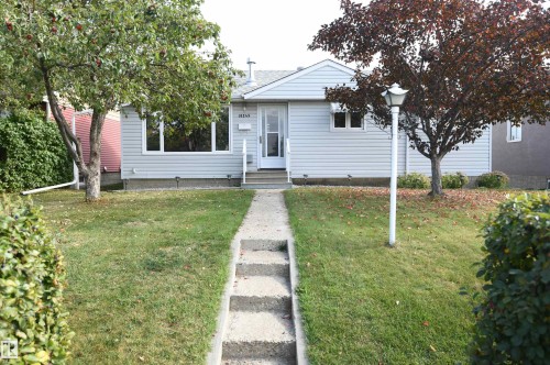 Outstanding value in this 3+2 bedroom bungalow with a gas fireplace, huge rec room, heated oversized garage with 220V, upgraded vinyl windows, recent shingles, high efficiency furnace, all on a quiet street, backing onto the park and ravine in Gold Bar - 10243 42 Street Nw, Edmonton, AB 