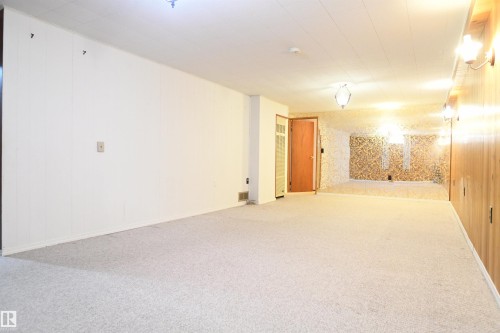 The family room stretches for what feels like miles, and still wears it's original charm.  This is clearly the room that the family, their kids, friends, and family made their memories in.  You can as well. - 10243 42 Street Nw, Edmonton, AB 
