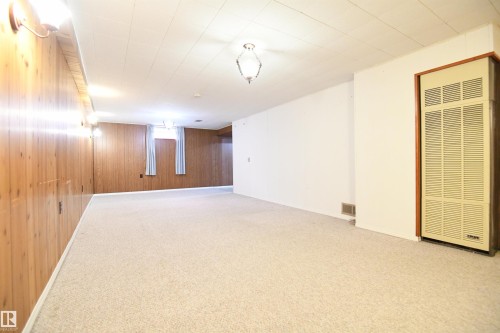The family room stretches for what feels like miles, and still wears it's original charm.  This is clearly the room that the family, their kids, friends, and family made their memories in.  You can as well. - 10243 42 Street Nw, Edmonton, AB 
