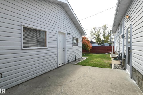 The patio is just outside of the rear door of the home, and connects to the oversized, heated garage.  Perfect for a patio sitting area, with a gas barbecue connection.  Maybe even add a pergola between the two structures for a modern touch - 10243 42 Street Nw, Edmonton, AB 