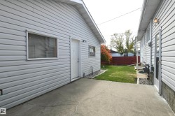 The patio is just outside of the rear door of the home, and connects to the oversized, heated garage.  Perfect for a patio sitting area, with a gas barbecue connection.  Maybe even add a pergola between the two structures for a modern touch - 