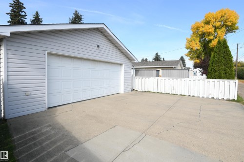 The garage is oversized, insulated, and has a new Reznor heater installed.  Full driveway in front of the garage is great for additional parking or projects, and the 220V plug in the garage is perfect for anyone with hobby or tool needs, or an EV charger - 10243 42 Street Nw, Edmonton, AB 