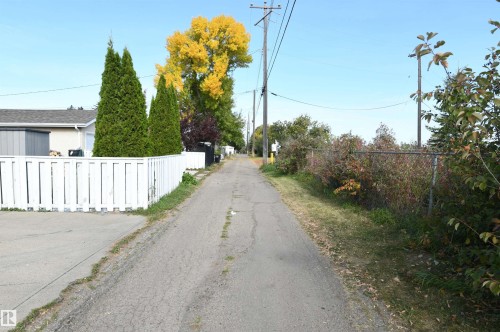 The rear lane backs onto the ravine that connects to Gold Bar Park.  Quiet, with no through traffic, this is a great family location - 10243 42 Street Nw, Edmonton, AB 