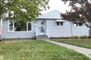 Outstanding value in this 3+2 bedroom bungalow with a gas fireplace, huge rec room, heated oversized garage with 220V, upgraded vinyl windows, recent shingles, high efficiency furnace, all on a quiet street, backing onto the park and ravine in Gold Bar - 10243 42 Street Nw, Edmonton, AB 