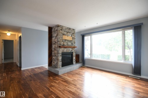 The extra large window in the living room lets in great natural light that you will notice immediately.  The main floor windows have all been upgraded and the casement design gives great ventilation.  Pride of ownership shows - 10243 42 Street Nw, Edmonton, AB 