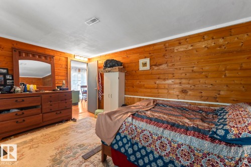 Wood-paneled wall detailing with a white ceiling and overhead lighting - #421 61209 Rge Rd 465, Rural Bonnyville M.D., AB 