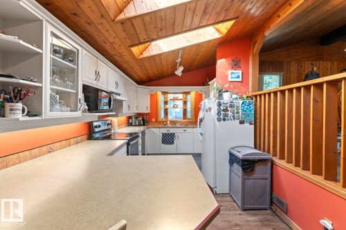 Wood-paneled ceilings with skylights - #421 61209 Rge Rd 465, Rural Bonnyville M.D., AB 