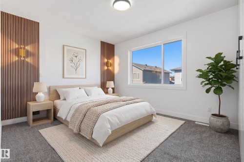 Vertical wood slat accent wall, flush-mount ceiling light, white trim window, wood-finish flooring, and wall-mounted sconces - 2720 63 Avenue, Rural Leduc County, AB 