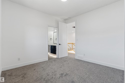 Plush carpet flooring and bright white walls - 2720 63 Avenue, Rural Leduc County, AB 