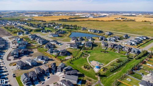 Residential development featuring a central green space, water feature, and a variety of architectural styles - 2720 63 Avenue, Rural Leduc County, AB 