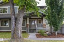 Two-story residence featuring gray siding and shingle accents - 55 Michigan Street, Devon, AB 