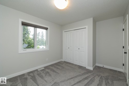 Plush carpeting and light gray wall paint - 55 Michigan Street, Devon, AB 