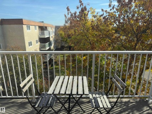 Balcony featuring a white metal railing and concrete flooring - #414 3611 145 Av Nw, Edmonton, AB 