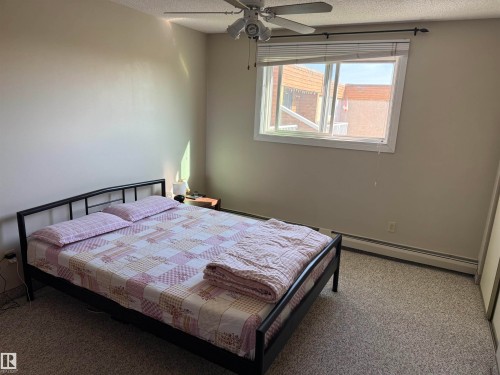 Recessed ceiling fan with light, white window frame, and neutral wall color - #414 3611 145 Av Nw, Edmonton, AB 