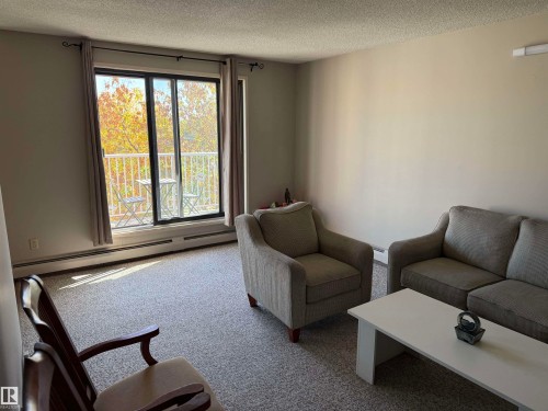 Sliding glass door opening to a private balcony - #414 3611 145 Av Nw, Edmonton, AB 