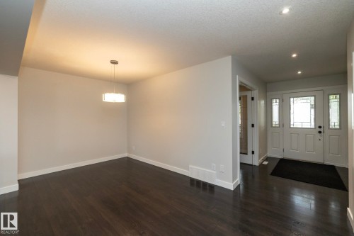 Hardwood flooring, recessed lighting, and a modern drum pendant light - 53 Michigan Street, Devon, AB 