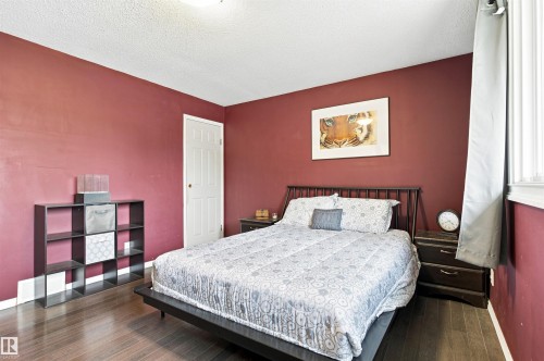 Wood-finish flooring with a white trim - 12 Hughes Road Nw, Edmonton, AB 