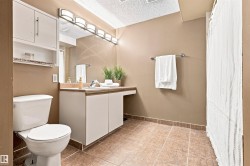 Vanity with integrated sink, extensive counter space, and under-cabinet storage - 