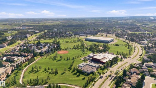Expansive green spaces, diverse residential buildings, visible roadways, and commercial structures - 12 Hughes Road Nw, Edmonton, AB 