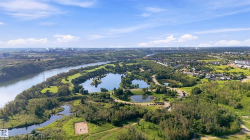 Expansive natural landscape featuring a prominent river, multiple serene ponds, and lush green areas - 12 Hughes Road Nw, Edmonton, AB 