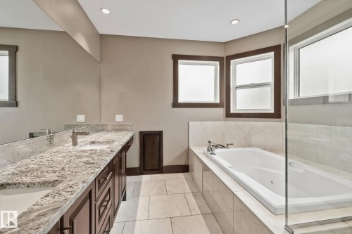 Dual vanity with stone countertop and integrated sinks - 10 Eldorado Drive, St. Albert, AB 