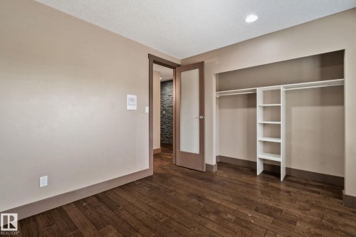 Wood-finish flooring with a neutral wall palette - 10 Eldorado Drive, St. Albert, AB 