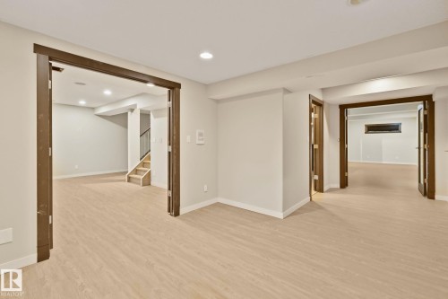Light wood-finish flooring with recessed lighting - 10 Eldorado Drive, St. Albert, AB 