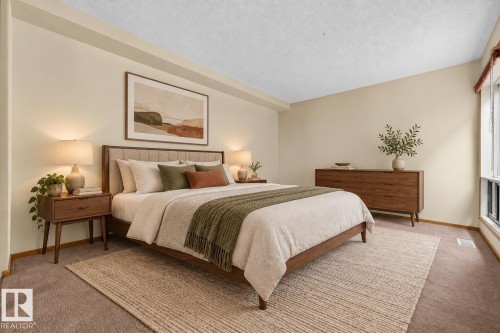 Recessed window with valance, light cream walls, and brown carpet flooring - #23 500 Lessard Dr Nw, Edmonton, AB 