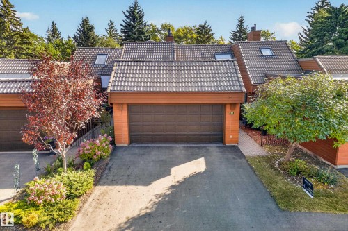 Multi-level structure featuring a tile roof, skylights, and attached garage - #23 500 Lessard Dr Nw, Edmonton, AB 