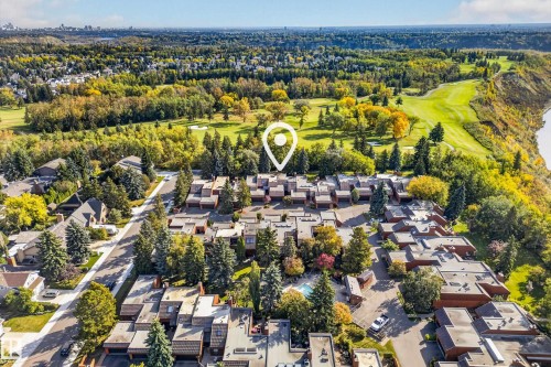 Aerial perspective of a multi-unit property, bordering a golf course and a river - #23 500 Lessard Dr Nw, Edmonton, AB 