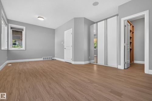 Wood-finish flooring, white trim, recessed lighting, and built-in closet shelving - 11167 62 Avenue Nw, Edmonton, AB 