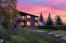 Contemporary exterior with dark siding and wood-finish accents - 11167 62 Avenue Nw, Edmonton, AB 