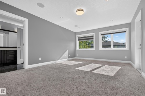 Recessed lighting, flush-mount ceiling light, built-in ceiling speakers, carpeting, and multiple windows - 11167 62 Avenue Nw, Edmonton, AB 