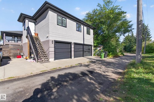 Two-story residence with stucco exterior and black trim windows - 11167 62 Avenue Nw, Edmonton, AB 