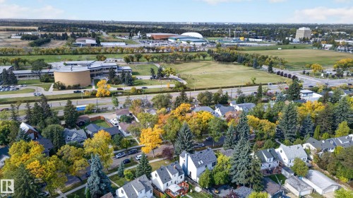 Residential properties surrounded by mature trees, with nearby academic buildings and athletic facilities - 11167 62 Avenue Nw, Edmonton, AB 