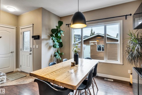 Hardwood-finish flooring, a large picture window, and a built-in overhead light fixture - 337 Southfork Drive, Leduc, AB 