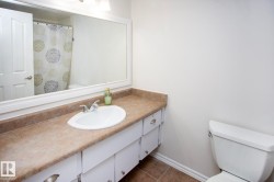 Vanity with a laminate countertop, integrated sink, and chrome-finish faucet - 