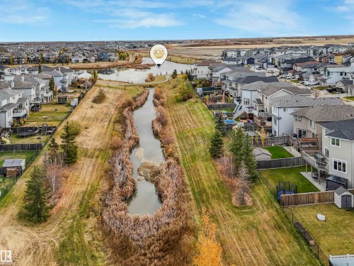 Residential community featuring a pond, established landscaping, and varied architectural styles - 36 Dalquist Bay, Leduc, AB 