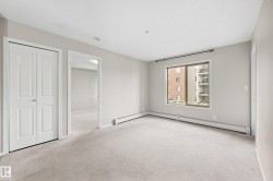 Neutral-toned walls complement the light-colored carpeting - 