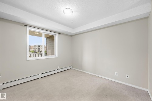 Wall-to-wall carpeting with baseboard heating - #215 11804 22 Av Sw, Edmonton, AB 