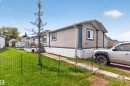 Siding exterior with decorative columns and a gabled entry - 1405 53222 Range Road 272, Rural Parkland County, AB 